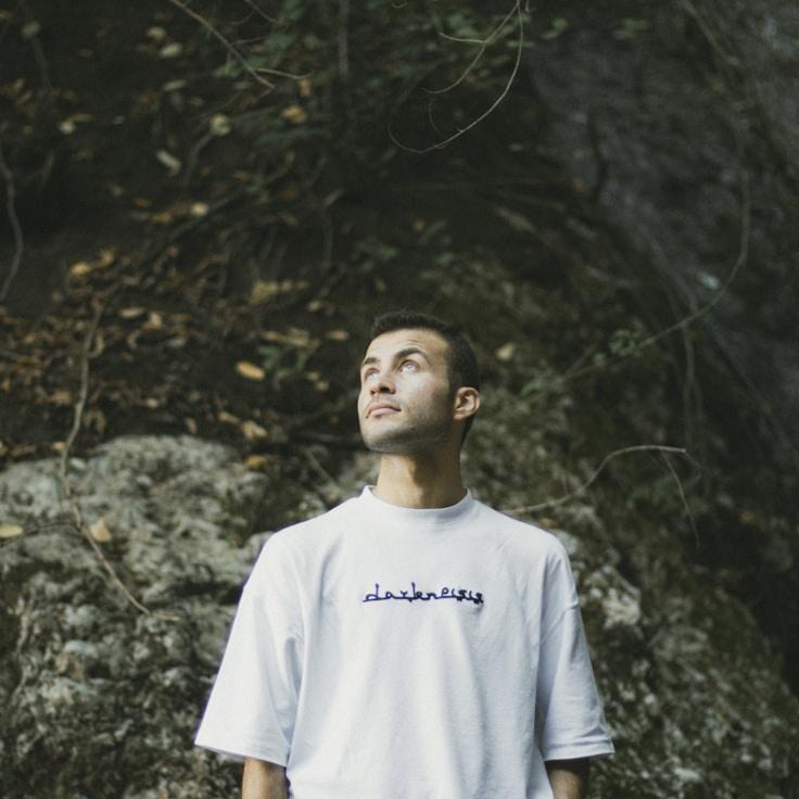 Kaveri Mehta, Lead Design Curator at Timber Ridge Crest, reviewing corporate floral arrangements